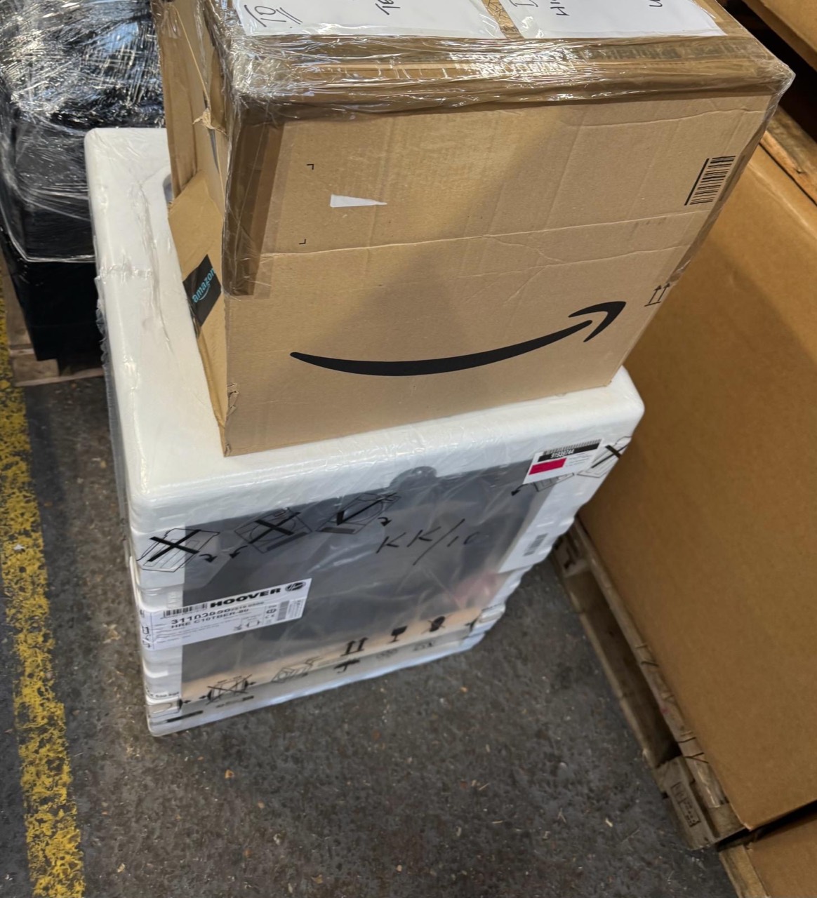 Boxed household goods and an appliance prepared for delivery