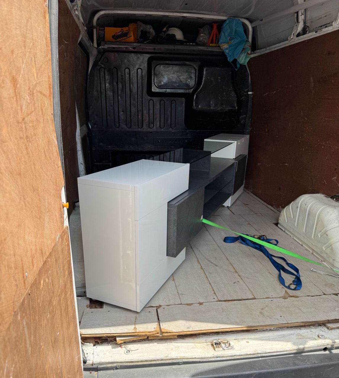 White and grey drawer units loaded inside the van